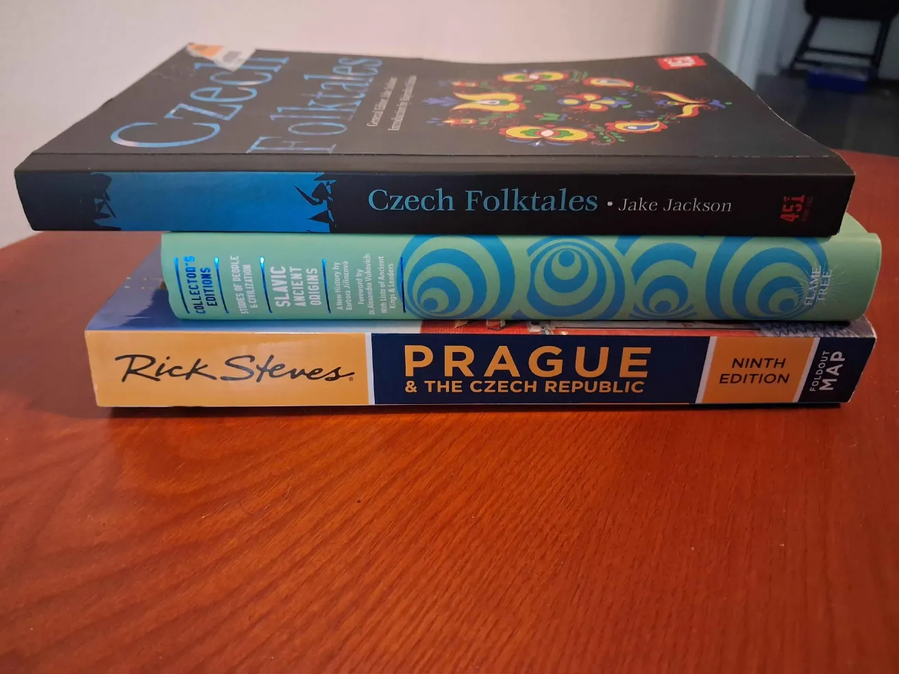 a stack of books on a wooden surface, Czech Folktales, Slavic Ancient Orgins, and Prague and the Czech Republic